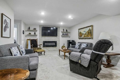 267 Cimarron Vista Court, Okotoks, AB - Indoor Photo Showing Living Room With Fireplace
