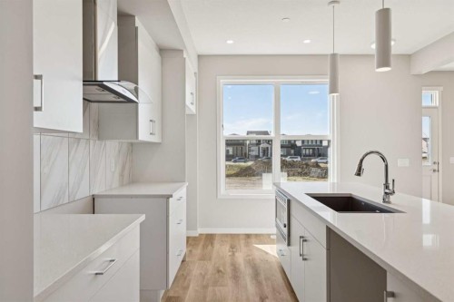 471 Hotchkiss Manor Se, Calgary, AB - Indoor Photo Showing Kitchen With Upgraded Kitchen