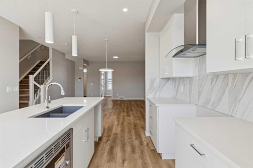 471 Hotchkiss Manor Se, Calgary, AB - Indoor Photo Showing Kitchen With Double Sink With Upgraded Kitchen