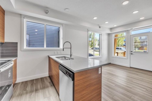 19625 45 Street Se, Calgary, AB - Indoor Photo Showing Kitchen With Double Sink