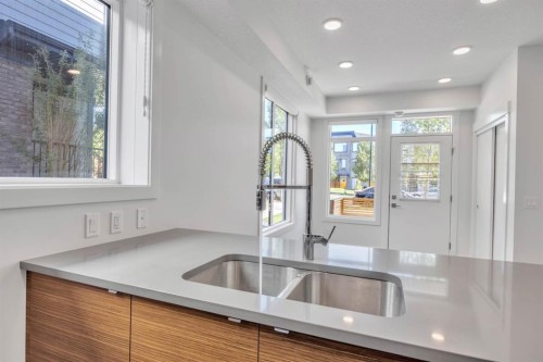 19625 45 Street Se, Calgary, AB - Indoor Photo Showing Kitchen With Double Sink
