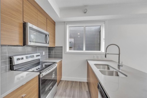 19625 45 Street Se, Calgary, AB - Indoor Photo Showing Kitchen With Double Sink