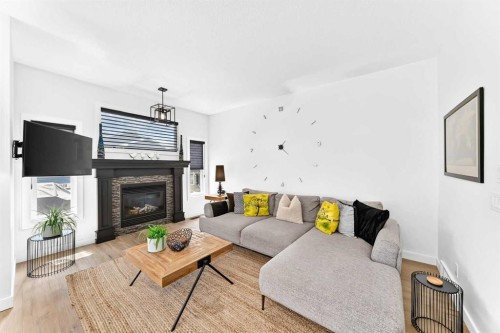 132 Evanscove Manor Nw, Calgary, AB - Indoor Photo Showing Living Room With Fireplace
