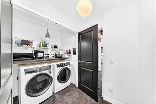 132 Evanscove Manor Nw, Calgary, AB - Indoor Photo Showing Laundry Room
