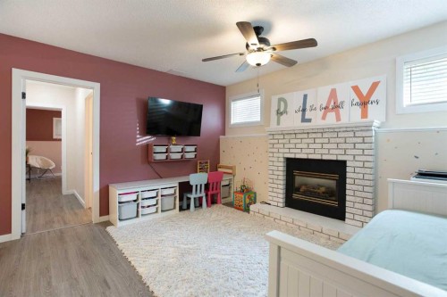 5 Shawglen Court Sw, Calgary, AB - Indoor Photo Showing Living Room With Fireplace