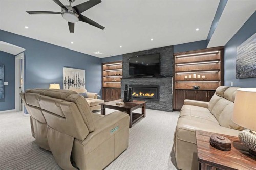 59 Evanswood Circle Nw, Calgary, AB - Indoor Photo Showing Living Room With Fireplace