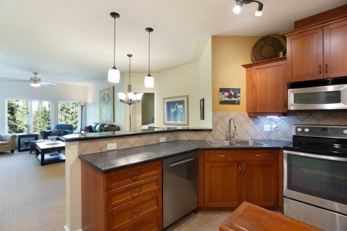 405-10 Discovery Ridge Close Sw, Calgary, AB - Indoor Photo Showing Kitchen With Double Sink