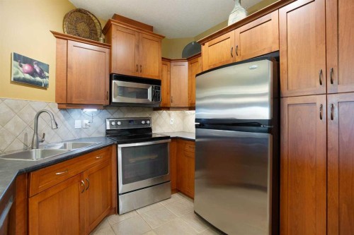 405-10 Discovery Ridge Close Sw, Calgary, AB - Indoor Photo Showing Kitchen With Double Sink