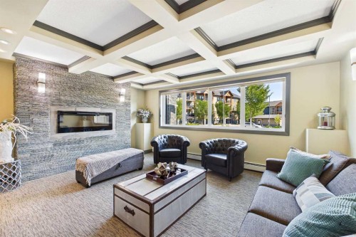 3307-402 Kincora Glen Road Nw, Calgary, AB - Indoor Photo Showing Living Room With Fireplace