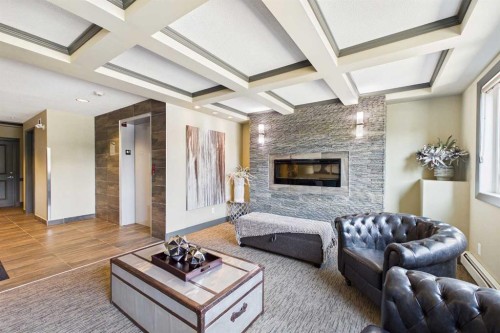 3307-402 Kincora Glen Road Nw, Calgary, AB - Indoor Photo Showing Living Room With Fireplace
