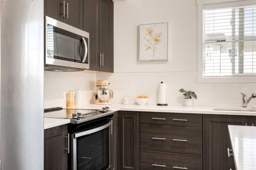 7310-151 Legacy Main Street Se, Calgary, AB - Indoor Photo Showing Kitchen With Upgraded Kitchen