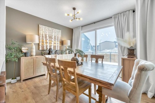 77 Versant Point Sw, Calgary, AB - Indoor Photo Showing Living Room With Fireplace