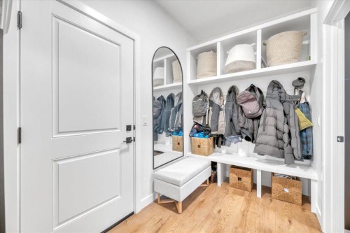 77 Versant Point Sw, Calgary, AB - Indoor Photo Showing Other Room With Fireplace