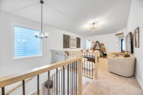 77 Versant Point Sw, Calgary, AB - Indoor Photo Showing Other Room