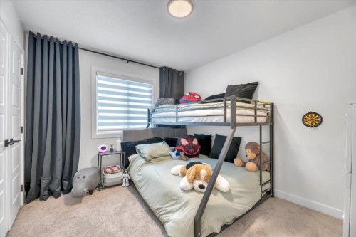 77 Versant Point Sw, Calgary, AB - Indoor Photo Showing Bedroom