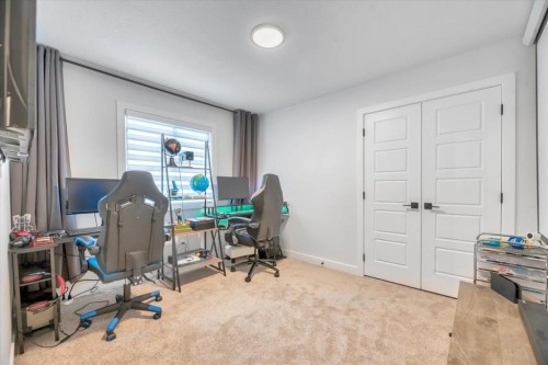 77 Versant Point Sw, Calgary, AB - Indoor Photo Showing Bedroom
