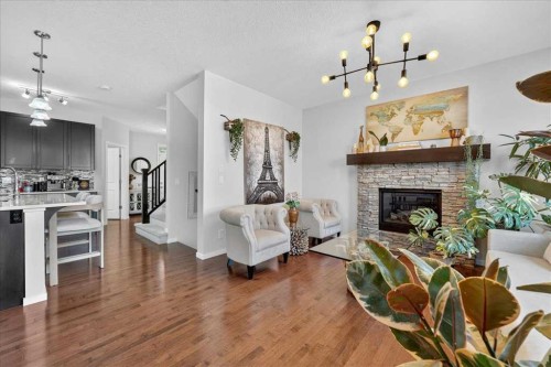 42 Nolancrest Rise Nw, Calgary, AB - Indoor Photo Showing Living Room With Fireplace