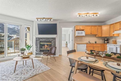 411-160 Kananaskis Way, Canmore, AB - Indoor With Fireplace