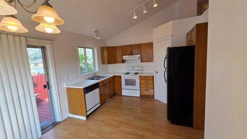 155 Applefield Close Se, Calgary, AB - Indoor Photo Showing Kitchen With Double Sink