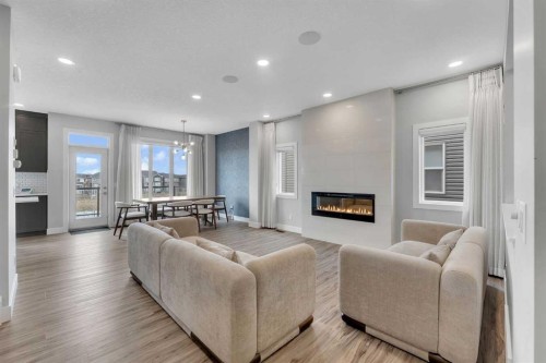 81 Carringvue Manor Nw, Calgary, AB - Indoor Photo Showing Living Room With Fireplace