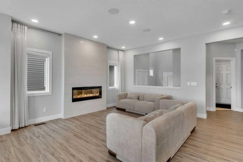 81 Carringvue Manor Nw, Calgary, AB - Indoor Photo Showing Living Room With Fireplace