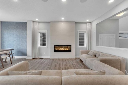 81 Carringvue Manor Nw, Calgary, AB - Indoor Photo Showing Living Room With Fireplace
