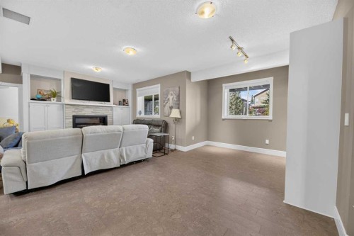 82 Briegel Road, Olds, AB - Indoor Photo Showing Living Room With Fireplace