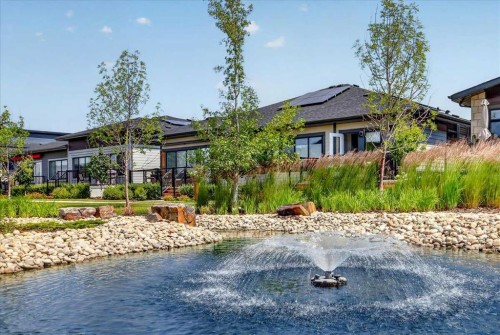 102-150 Marina Cove Se, Calgary, AB - Outdoor With Body Of Water