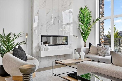 102-150 Marina Cove Se, Calgary, AB - Indoor Photo Showing Living Room With Fireplace