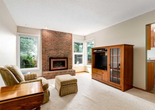 7919 Silver Springs Road Nw, Calgary, AB - Indoor Photo Showing Living Room With Fireplace
