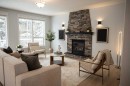 3 Strathridge Bay Sw, Calgary, AB  - Indoor Photo Showing Living Room With Fireplace 