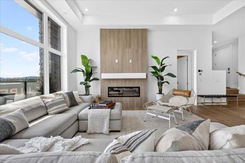 101-150 Marina Cove Se, Calgary, AB - Indoor Photo Showing Living Room With Fireplace