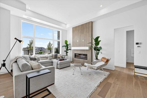 101-150 Marina Cove Se, Calgary, AB - Indoor Photo Showing Living Room With Fireplace