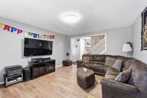 227 Abalone Place Ne, Calgary, AB - Indoor Photo Showing Living Room