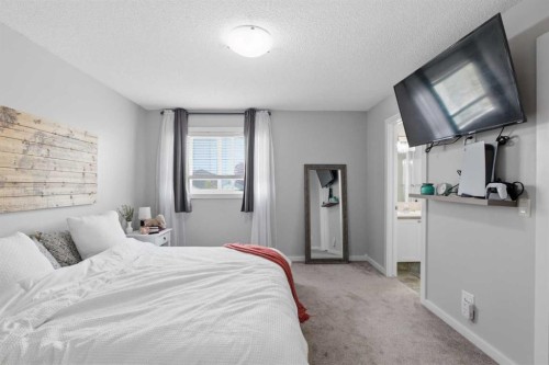9 Ross Place, Crossfield, AB - Indoor Photo Showing Bedroom