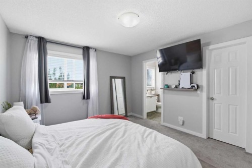 9 Ross Place, Crossfield, AB - Indoor Photo Showing Bedroom