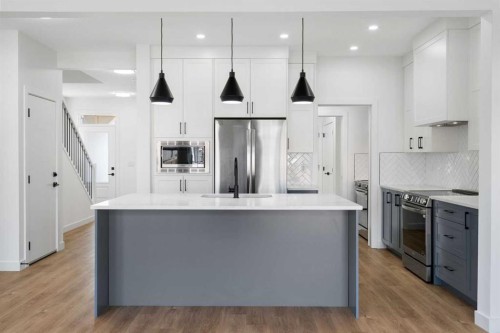 12 Copperhead Garden Se, Calgary, AB - Indoor Photo Showing Kitchen With Stainless Steel Kitchen With Upgraded Kitchen