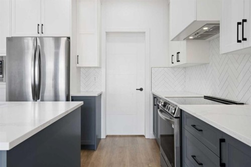 12 Copperhead Garden Se, Calgary, AB - Indoor Photo Showing Kitchen With Stainless Steel Kitchen