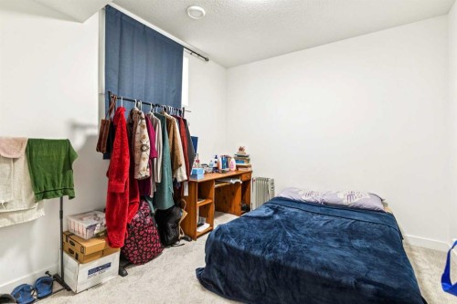 12 Copperhead Garden Se, Calgary, AB - Indoor Photo Showing Bedroom