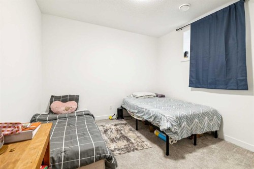 12 Copperhead Garden Se, Calgary, AB - Indoor Photo Showing Bedroom
