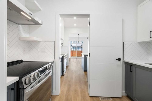 12 Copperhead Garden Se, Calgary, AB - Indoor Photo Showing Kitchen With Upgraded Kitchen