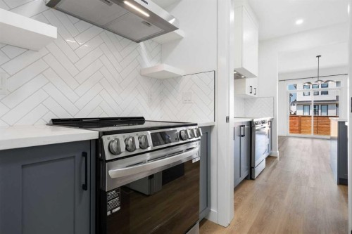 12 Copperhead Garden Se, Calgary, AB - Indoor Photo Showing Kitchen With Stainless Steel Kitchen With Upgraded Kitchen