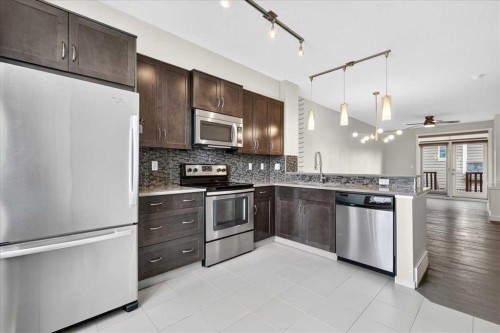 77 Kinlea Way Nw, Calgary, AB - Indoor Photo Showing Kitchen With Stainless Steel Kitchen With Upgraded Kitchen
