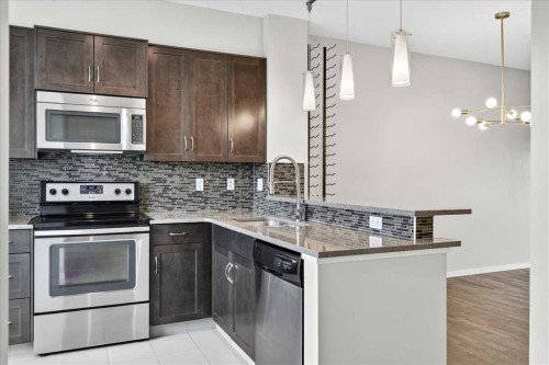77 Kinlea Way Nw, Calgary, AB - Indoor Photo Showing Kitchen With Stainless Steel Kitchen With Upgraded Kitchen