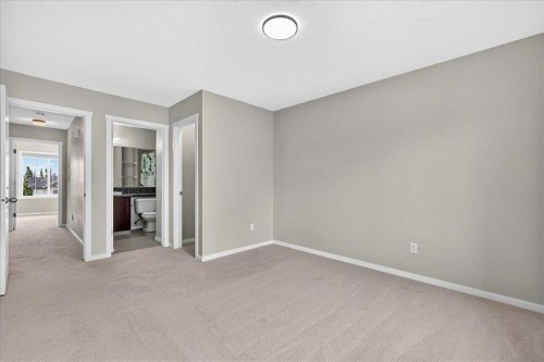77 Kinlea Way Nw, Calgary, AB - Indoor Photo Showing Other Room