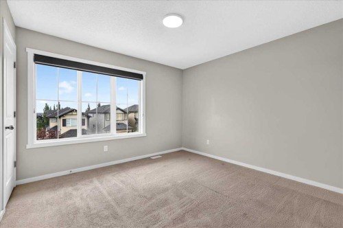 77 Kinlea Way Nw, Calgary, AB - Indoor Photo Showing Other Room