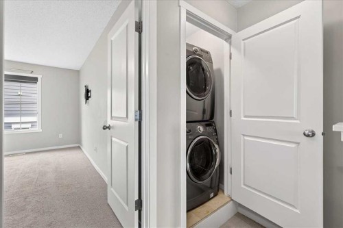 77 Kinlea Way Nw, Calgary, AB - Indoor Photo Showing Laundry Room