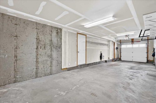 77 Kinlea Way Nw, Calgary, AB - Indoor Photo Showing Garage