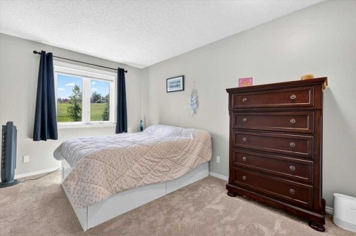 76-16044 258 Avenue East, Rural Foothills County, AB - Indoor Photo Showing Bedroom