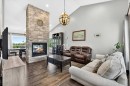 76-16044 258 Avenue East, Rural Foothills County, AB  - Indoor Photo Showing Living Room With Fireplace 